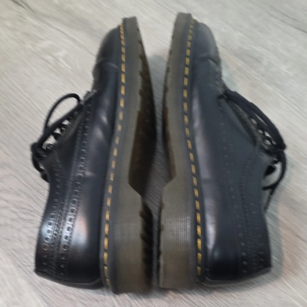 Dr. Martens Black Leather Wingtip Oxfords with Yellow Stitching